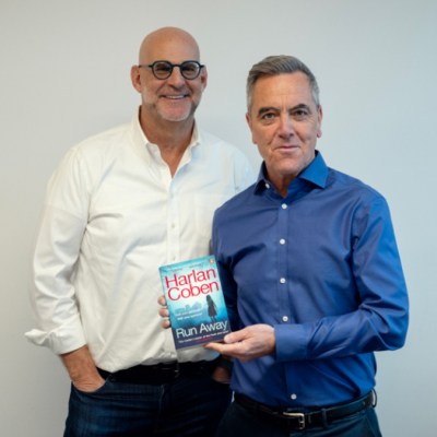 Harlan Coben and James Nesbitt with a copy of Coben's novel Run Away