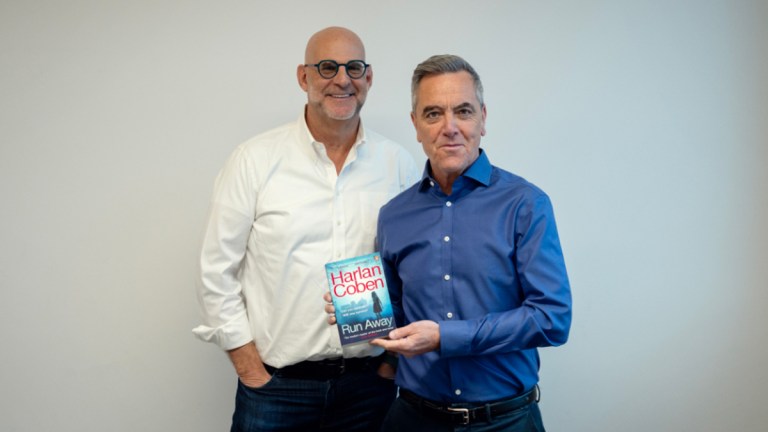 Harlan Coben and James Nesbitt with a copy of Coben's novel Run Away